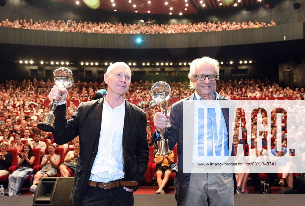 Director Ken Loach, right, and his long-time screenwriter Paul Laverty receive the Crystal Globe for Outstanding Artistic Contribution to World Cinema within the 52nd International Film Festival in Karlovy Vary, Czech Republic, on July 3, 2017. The award was presented to two individuals who together have influenced the history of British cinema. (CTKxPhoto KaterinaxSulova) CTKPhotoP201707030548601 suk16
