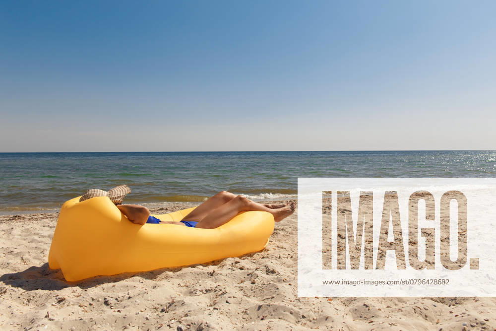 Girl relaxing on lamzac on the beach. Summer holiday idyllic on a tropical island., model released, , 48415090.jpg, happy, slim, inflatable, model, sunglasses, sofa, sand, ocean, woman, young, air, holiday, summer, sea, lamzac, leisure, hammock, relax, outdoors, yellow, soft, beach, fun, beautiful, vibrant, attractive, girl, comfortable, style, mattress, bikini, lifestyle, sitting, fashion, waves, island, paradise, adult, vacation, rest, resting, nature, hat, air sofa, tropical, blue, travel, chill RECORD DATE NOT STATED