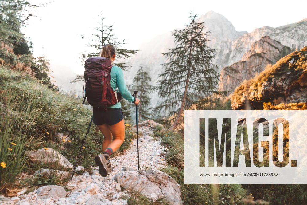 Caucasian woman hiking with Backpack on the Beautiful trail in European Alps early in the morning. Travel and Adventure Concept. High quality photo, model released, , 51013044.jpg, sport, trekking, girl, walking, love, summer, freedom, leisure, nature, mountain, travel, activity, caucasian, tree, hiker, vacation, male, outdoors, sun, tourism, two, backpack, active, sunny, tourist, hike, female, top, hill, healthy, landscape, couple, woman, man, lifestyle, climbing, adventure, young, outdoor, enjoying, person, happy, people, spring, view, hand, hiking, together RECORD DATE NOT STATED