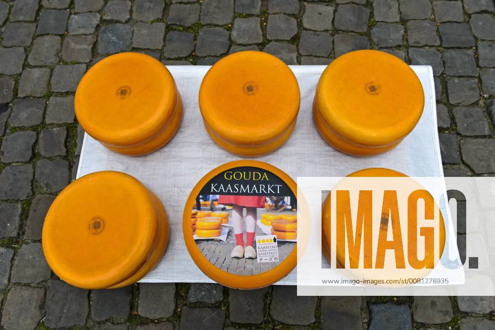 Gouda cheese wheels piled up on the cheese market, Gouda, Netherlands