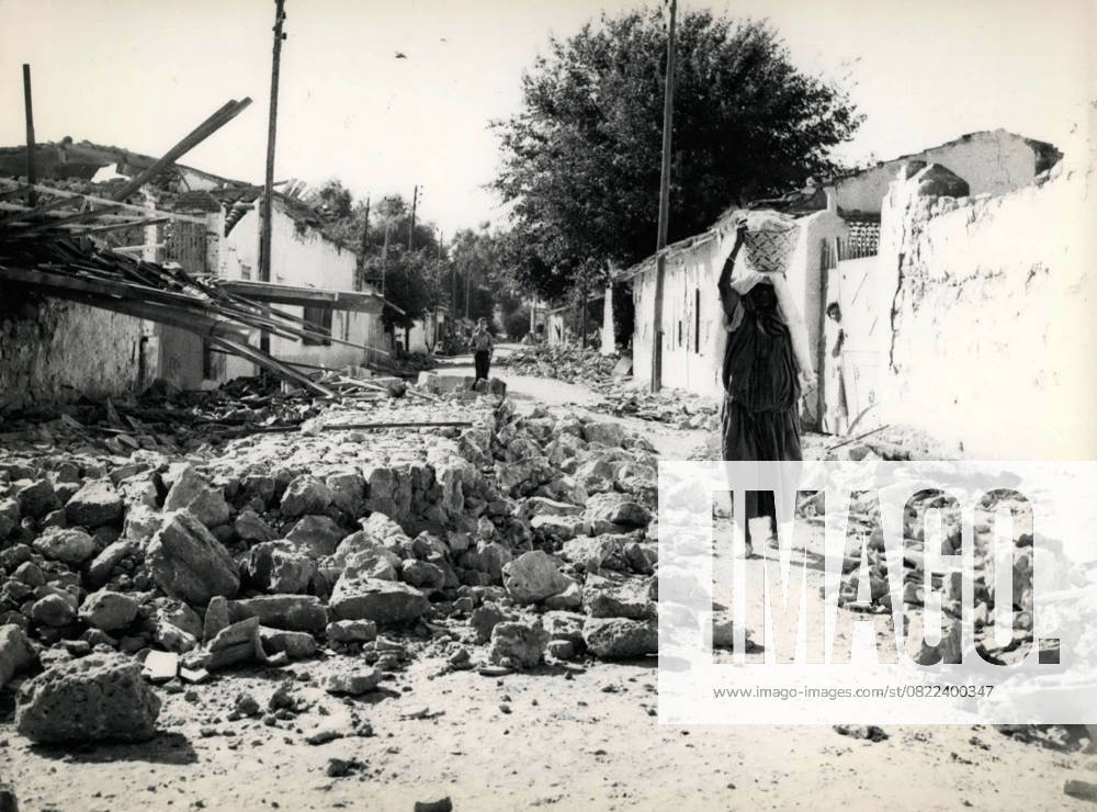 Africa Egypt 14 September 1954 Scenes of Earthquake in Algeria a Locals Ms, the to Arabic Art a Basket at the Head carries, walked through the Debris one from Earthquake destroyed Village Picture credits Keystone Pictures USA ZUMAPRESS Com