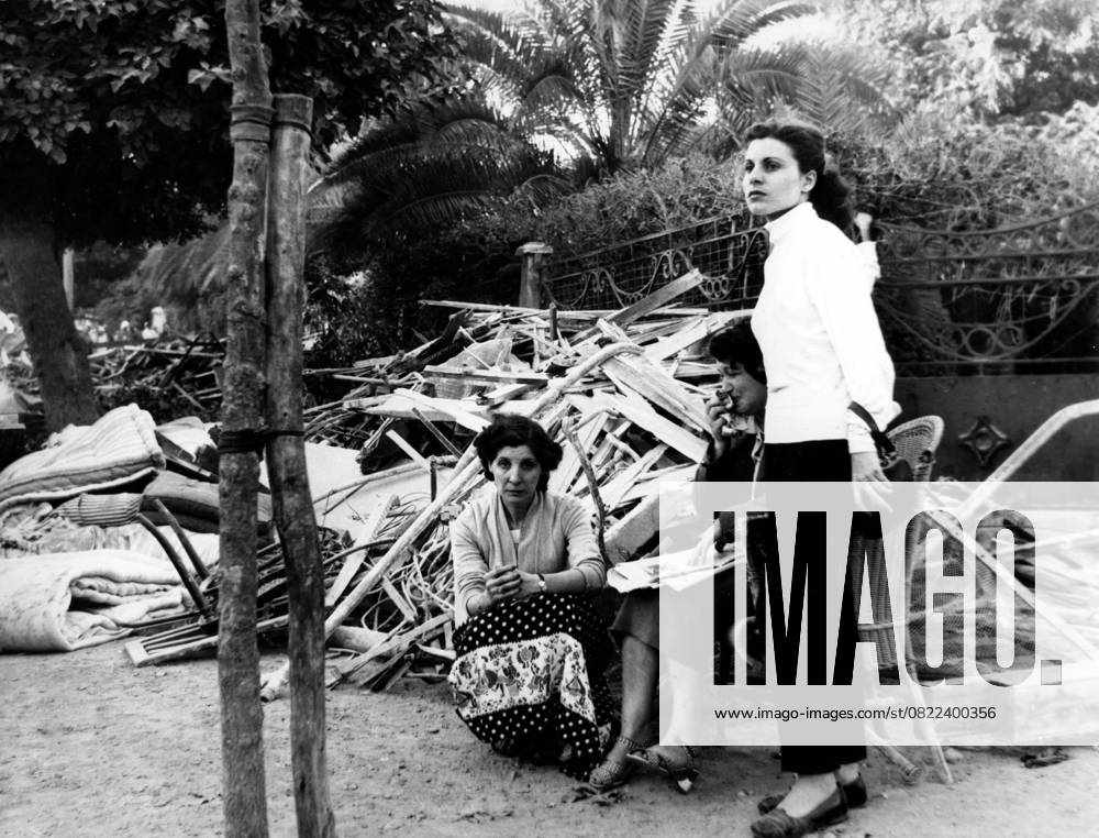 Natural disasters Earthquake 1954 in Algeria 14 September 1954 Orleansville, Algeria French Population from Ville Orleans Camping at Garden the Old Woman at Chair cries bitterly to the Earthquake at September 1954 in Algeria at the Catastrophe in the African Country Kamen 1 400 People ums Life, 14 000 were violated Orleansvile Algeria
