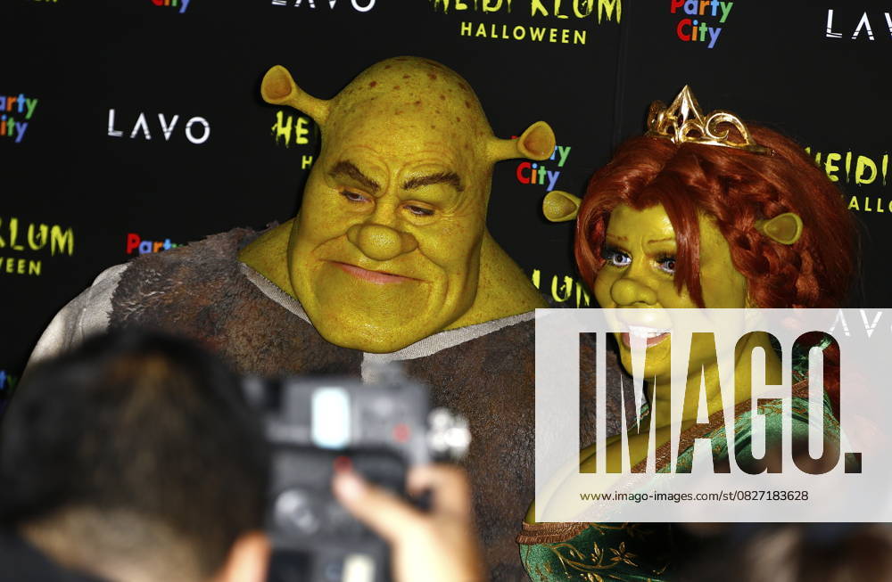Heidi Klum and her partner Tom Kaulitz dressed up as Fiona and Shrek arrive in a carriage at the annual Halloween bash in New York, on October 31st 2018 Heidi Klum and Tom Kaulitz dressed up as Fiona and Shrek at her Annual Halloween bash in a horse drawn carriage, in New York, on October 31st 2018 New York United States