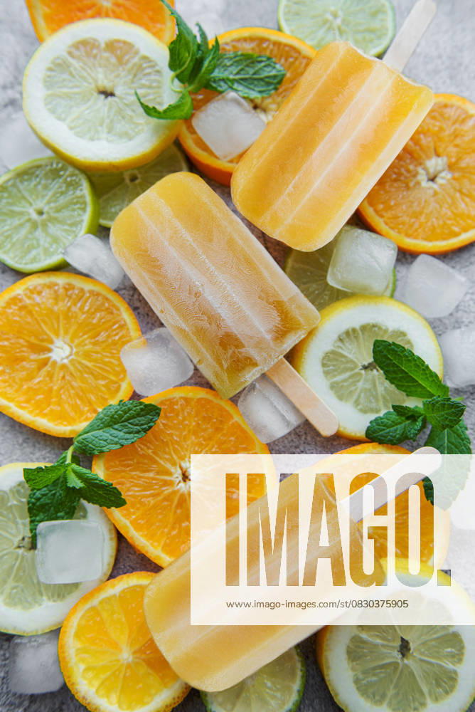Fruit orange ice popsicle, ice cubes and slices of citrus fruits. Model Released OlenaRudo_ID30879_1046777_030