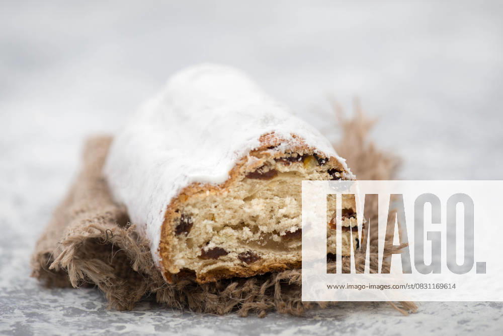 Christmas stollen, Traditional Christmas stollen with Nuts, Raisins, Marzipan and Spices, Cinnamon and Star anise 1133602802