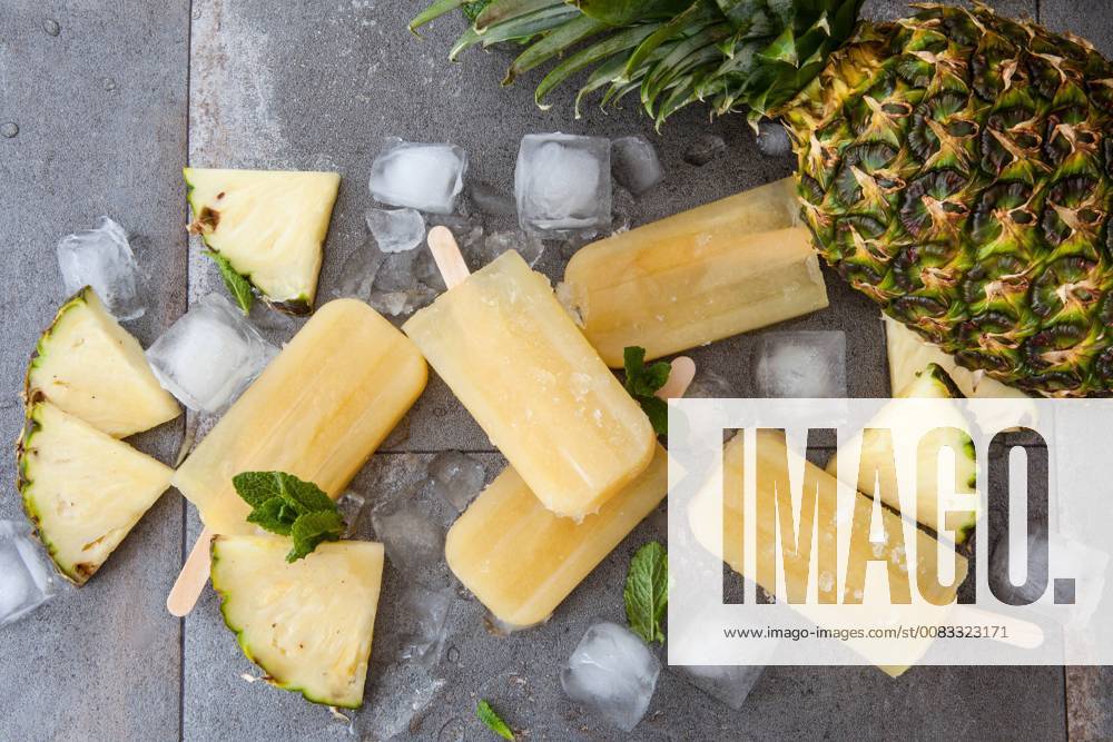 Homemade popsicles with fresh pineapple. Frozen pineapple popsicles 1079704926