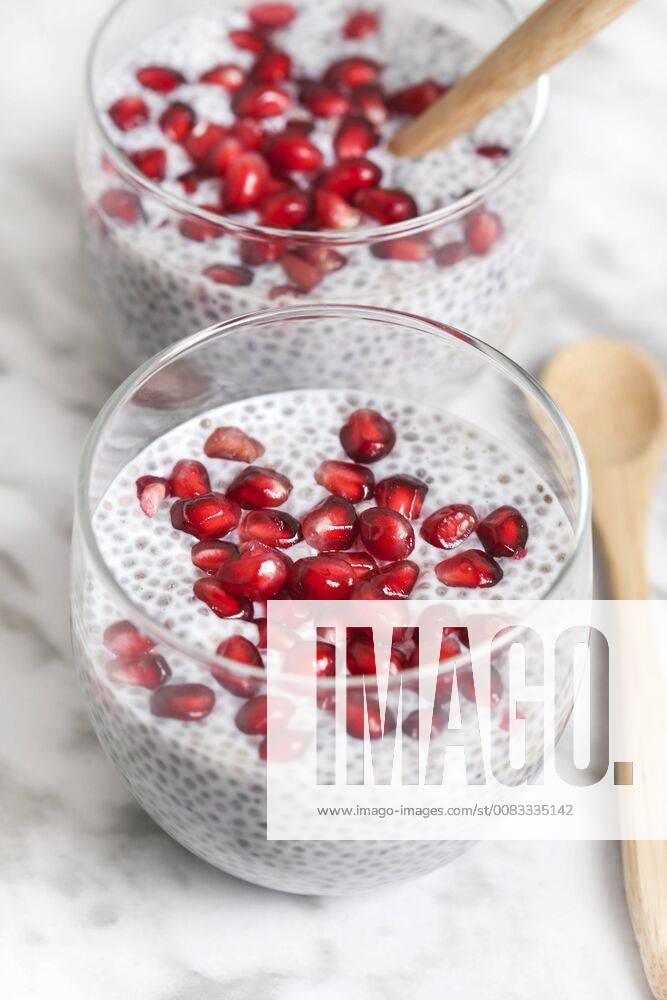 Two glasses of chia pudding with pomegranate seed RTBF01150