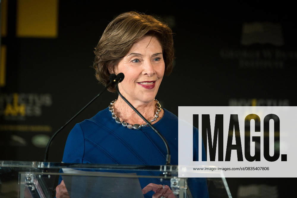 Invictus Games Symposium on Invisible Wounds in Orlando May 8, 2016 - Orlando, FL, United States of America - Former First Lady Laura Bush introduces Prince Harry and her husband former President George W Bush during the 2016 Invictus Games Symposium on Invisible Wounds May 8, 2016 in Orlando, Florida. The symposium hosted by Prince Harry and former President George W. Bush sought to remove the stigma suffered by victims of post traumatic stress and other injuries that are not regularly visible.