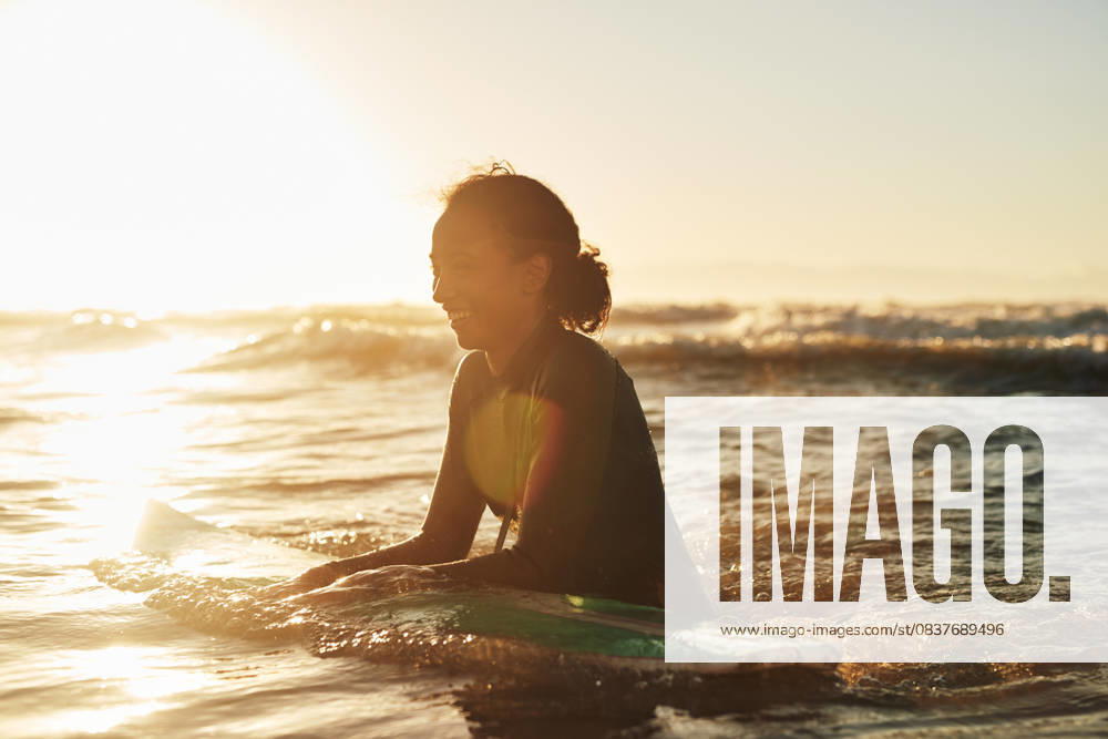 Surfer, woman and swimming in ocean with wetsuit for summer adventure, sunset and fun activity in water. Girl, surfing sport and floating in waves with board for vacation travel, exercise and peace Surfer, woman and swimming in ocean with wetsuit for summer adventure, sunset and fun activity in water. Girl, surfing sport and floating in waves with board for vacation travel, exercise and peace., model released, , 60609452.jpg RECORD DATE NOT STATED