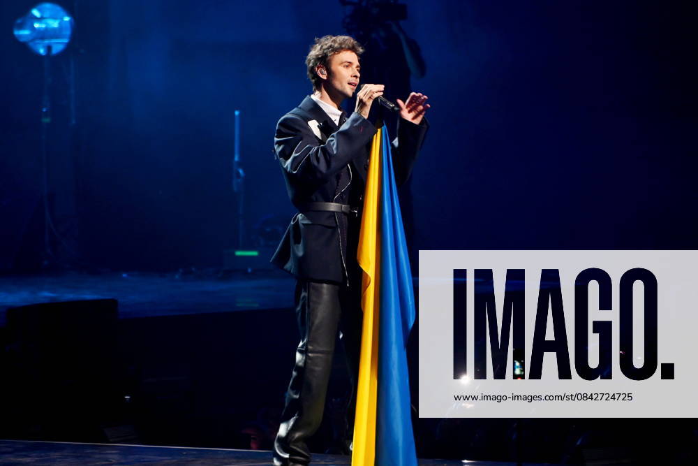 Solo concert of Ukrainian singer Max Barskih in Kyiv - 13 Dec 2025 Ukrainian singer Max Barskih with the Ukrainian flag during his performance at the Kyiv Palace of Sports. Kyiv Ukraine