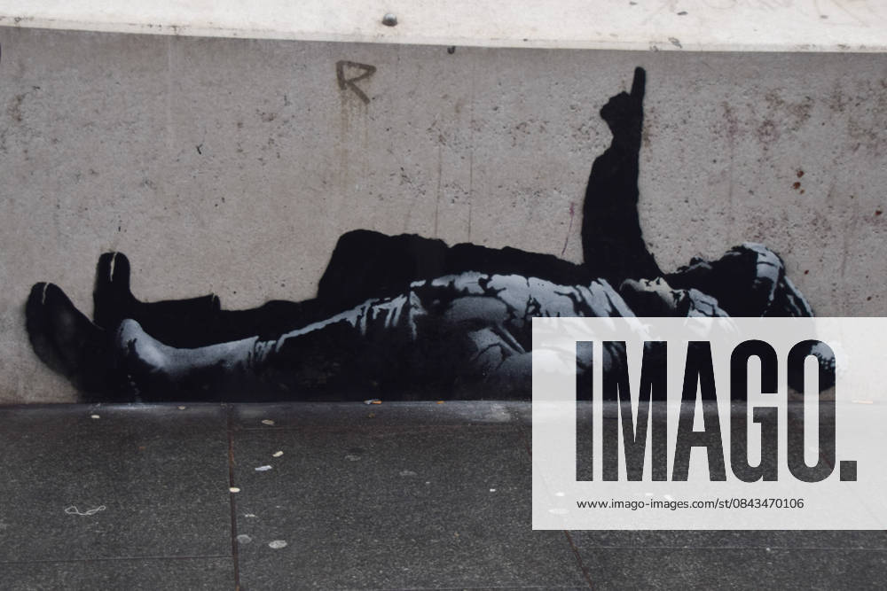 A new artwork, suspected to be by elusive street artist Banksy, has appeared outside Centre Point and Tottenham Court Road Station. The artwork depicts two children lying on their backs and pointing upwards. The artwork has not yet been confirmed as a genuine Banksy. London United Kingdom - ZUMAv130 20251221_zip_v130_003