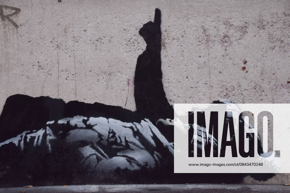 A new artwork, suspected to be by elusive street artist Banksy, has appeared outside Centre Point and Tottenham Court Road Station. The artwork depicts two children lying on their backs and pointing upwards. The artwork has not yet been confirmed as a genuine Banksy. London United Kingdom - ZUMAv130 20251221_zip_v130_006