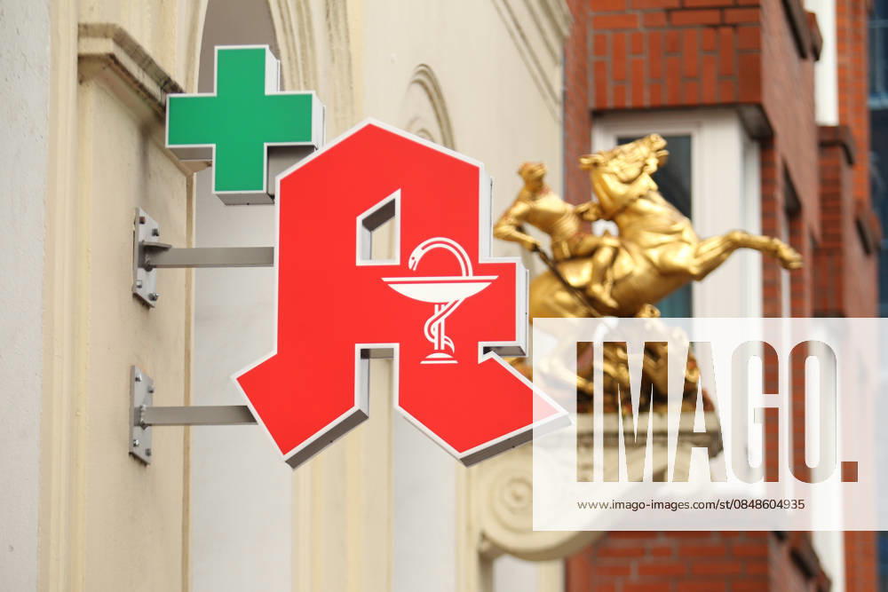A pharmacy A hangs on the facade of a pharmacy in Lange Reihe Behind it, a gold sculpture has been attached to the facade St Georg Hamburg