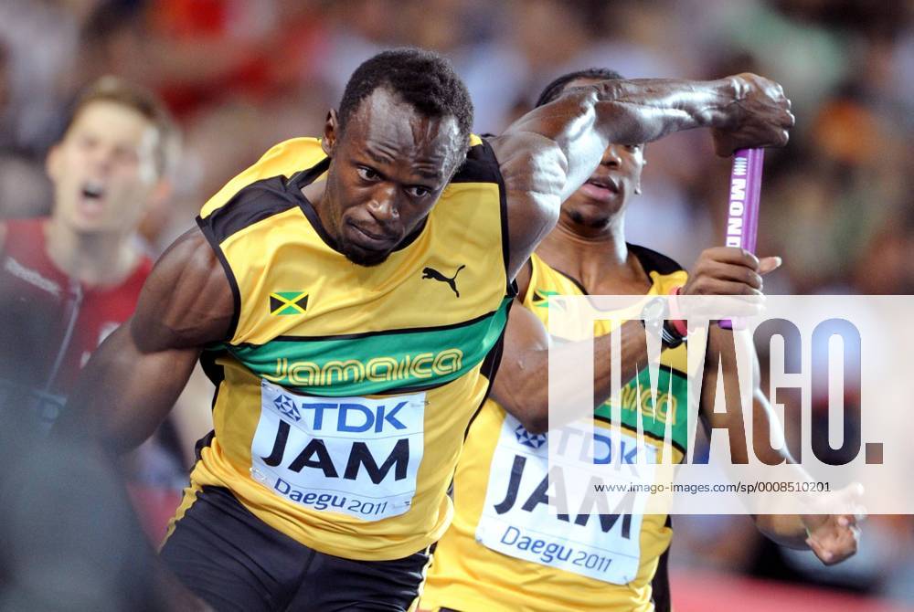 (110904) -- DAEGU, Sept. 4, 2011 (Xinhua) -- Usain Bolt(L) of team of Jamaica holds the baton handed from his teammate during the men s 4x100 metres relay final at the IAAF World Championships in Daegu, South Korea, on Sept. 4, 2011. (Xinhua Chen Xiaowei) SOUTH KOREA-DAEGU-IAAF-WORLD CHAMPIONSHIPS-DAY 9