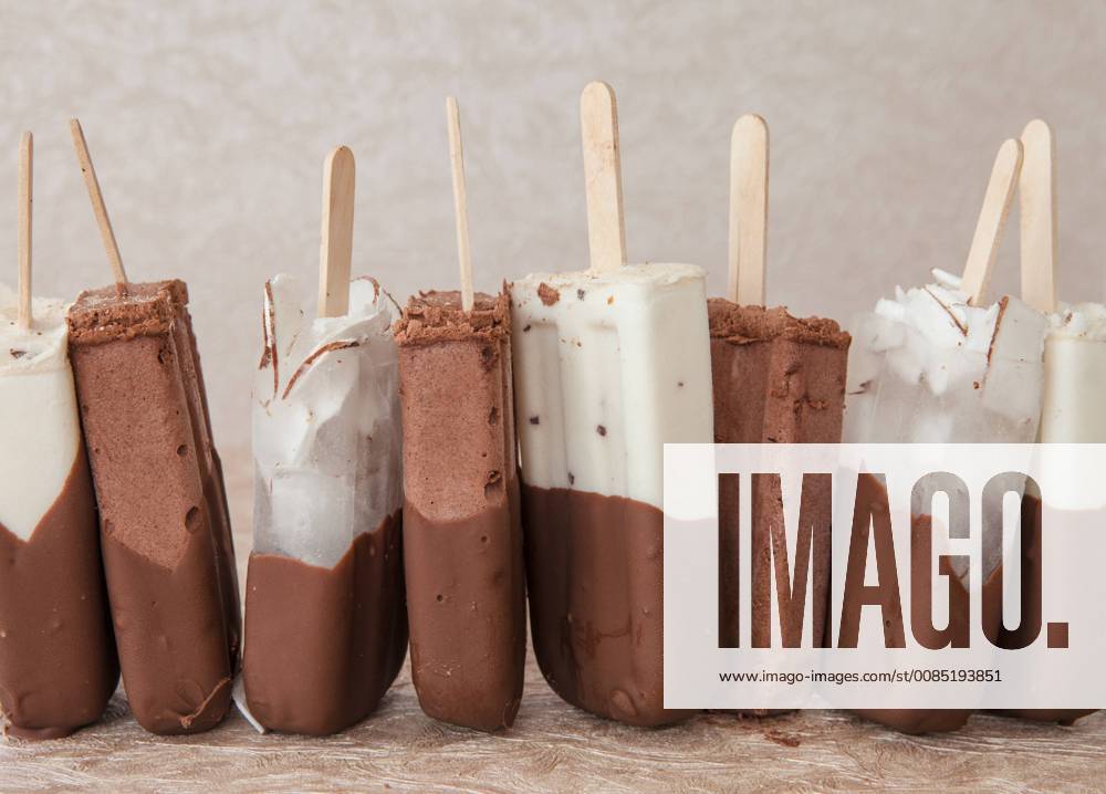 Popsicles with chocolate vanilla and coconut ice cream popsicles 1079705136