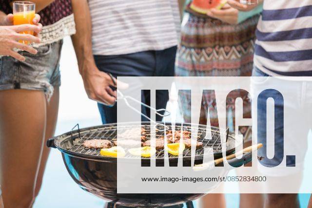 Mid section of friends preparing barbecue Mid section of friends preparing barbecue near pool, model released, , property released, Cape Town, South Africa, 03.11.2015, 690223.jpg, friend, friendship, casual clothing, swimming pool, poolside, sunny, summer, bright, resort, standing, glass, juice, fruit juice, beverage, refreshment, grill, bbq, meal, cooking, meat, barbecue, lunch, tongs, preparing, attractive, beautiful, handsome, fashion, stylish, carefree, escapism, holiday, vacation, leisure, lifestyle, luxury, recreation, travel, happy, enjoyment, fun, together 20s, Young Adult, Man, Male, Caucasian, Woman, Female, 25-29 Years, Young Men, Caucasian Ethnicity, 20-24 Years, Young Women Outdoors,Focus on Foreground,Day,Mid Section