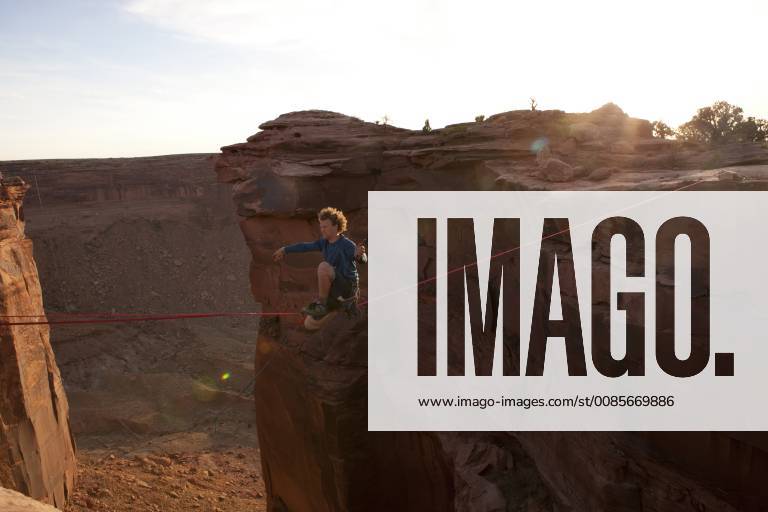 Andy Lewis preparing to cut his highline with a knife in the film Sketchy Andy, Fruit Bowl Moab Utah, Boulder Colorado United States