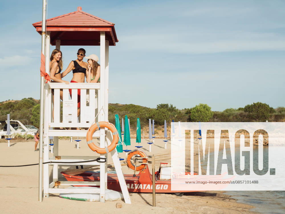 Rescue Boat and Lifeguard Tower with Three Women at Beach Porto San Paolo, Sardegna, Italy CR_MORW2605135D-2024260-01 ,model released, Symbolfoto