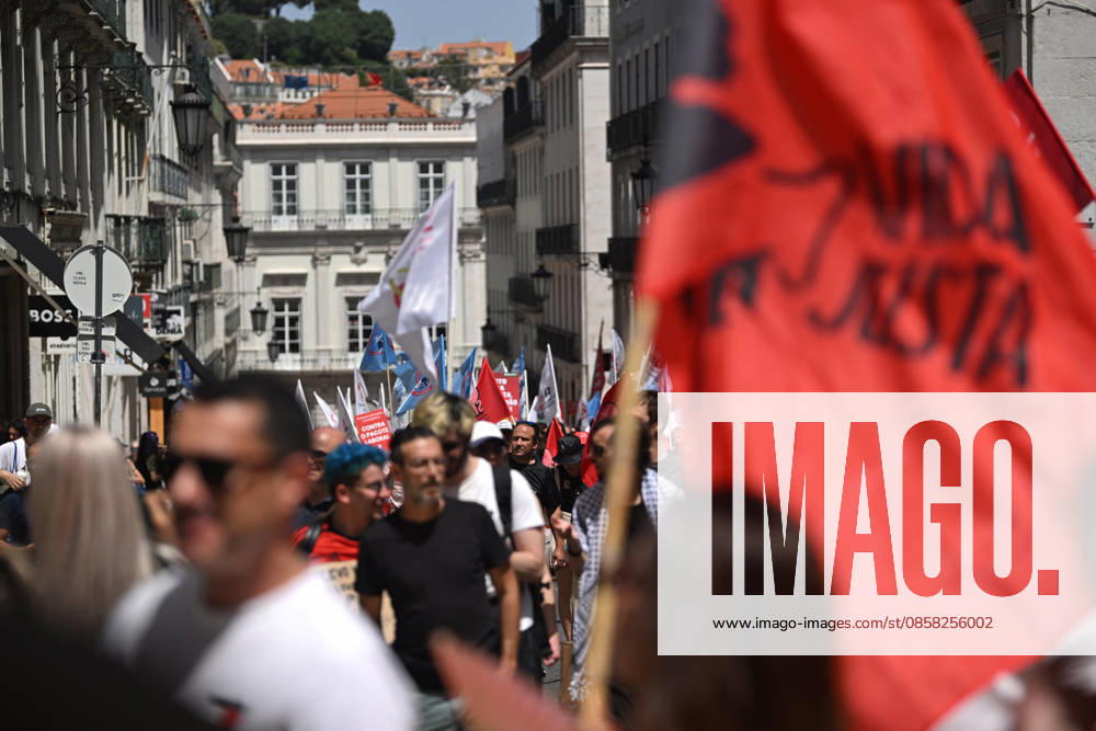Nationwide Strike For Workers Lisbon LISBON, PORTUGAL - JUNE 03: Protesters hold a banner and wave red trade union flags as they line the streets during a national mobilization in Lisbon, Portugal on June 03, 2026. The demonstration, organized under the National Fight Day motto, demands increased wages, guaranteed labor rights, and measures against the rising cost of living, while advocating for the right to health and housing. Zed Jameson Anadolu Lisbon Portugal. Editorial use only. Please get in touch for any other usage.