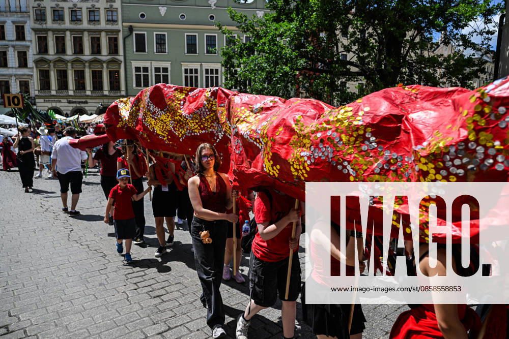 Poland s 25th Dragon Parade in Krakow KRAKOW, POLAND - JUNE 07: People take part the Dragon Parade during the 25th Great Dragon Parade edition at the Main Square, Krakow, Poland, on June 07, 2026. For the 25th year in a row, Krakow brings the annual celebration representing the myth of Dragon, the city symbol. Omar Marques Anadolu Krakow Poland. Editorial use only. Please get in touch for any other usage.