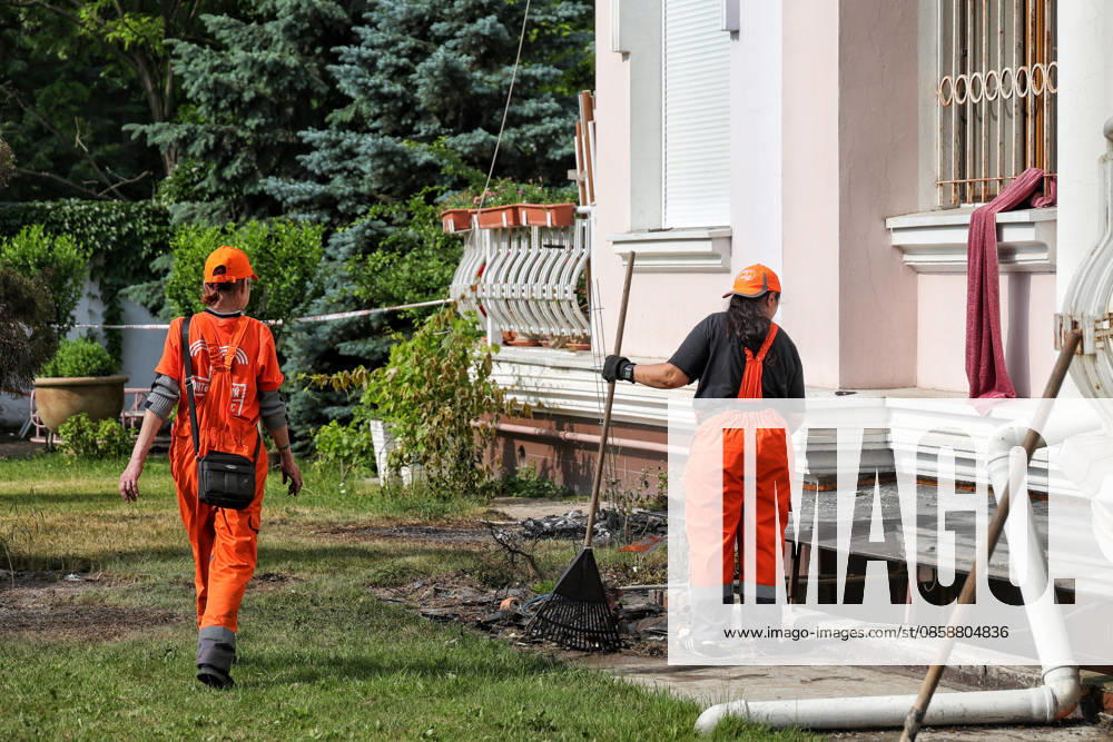 Utility workers clear debris outside a multi-storey residential building damaged in a Russian drone attack on Odesa, Ukraine, on June 10, 2026. The Russian army attacked the city with strike drones. Residential buildings were damaged in the attack. Three people were injured, including two children (Photo by Nina Liashonok Ukrinform) Russian drone strike damages housing in Odesa