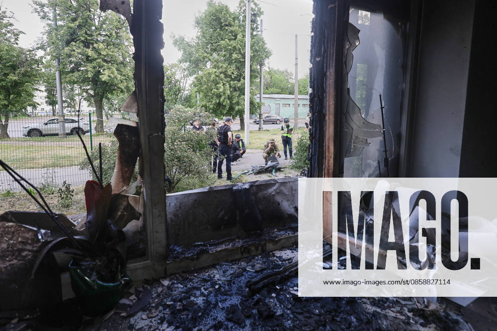 Law enforcement officers examine the wreckage of a strike drone used by Russian forces to attack a district of Kharkiv, Ukraine, June 10, 2026. Russian forces struck the northeastern city with drones, injuring at least eight people. One of the drones hit an apartment block, housing a dental office. (Photo by Viacheslav Madiievskyi Ukrinform) Russians damage dental office in Kharkiv