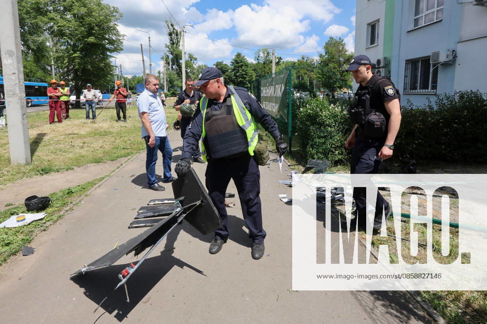 A law enforcer holds a piece of a drone that Russian forces used to attack a district of Kharkiv, Ukraine, June 10, 2026. Russian forces struck the northeastern city with drones, injuring at least eight people. One of the drones hit an apartment block, housing a dental office. (Photo by Viacheslav Madiievskyi Ukrinform) Russians damage dental office in Kharkiv