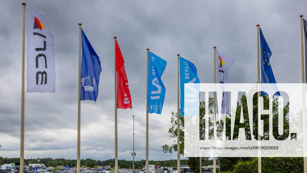 Trade visitor day at ILA Berlin 2026, Berlin, 12 06 2026 Several flagpoles with ILA Berlin flags as well as a flag of the European Commission and the EU flag in the wind The flags bear the lettering ILA Berlin and the slogan Pioneering Aerospace Schöneberg Berlin ExpoCenter Airport Brandenburg Germany 20260612-286A0028-M4000