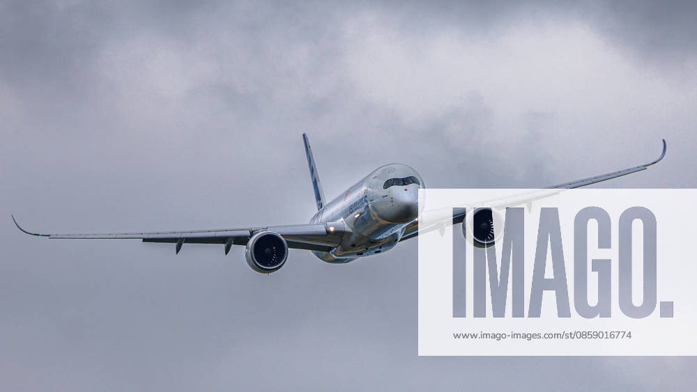 Trade visitor day at ILA Berlin 2026, Berlin, 12 06 2026 An Airbus A350 1000 in the Airbus house livery can be seen climbing against a cloudy sky The aircraft wears the characteristic carbon finish of the manufacturer Schöneberg Berlin ExpoCenter Airport Brandenburg Germany 20260612-1V9A1744-M4000
