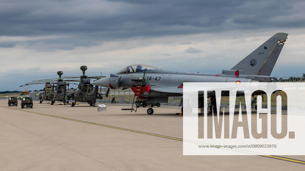 Trade visitor day at ILA Berlin 2026, Berlin, 12 06 2026 A Eurofighter Typhoon of the Spanish Air Force registration number 14 47, C 16 47 stands on the apron, behind it a Tiger combat helicopter Both aircraft are parked under a cloudy sky on the exhibition grounds of the ILA Berlin Schöneberg Berlin ExpoCenter Airport Brandenburg Germany 20260612-286A9983-M4000