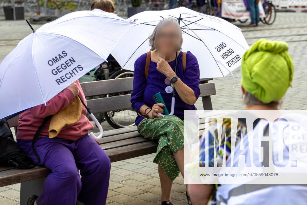 Augsburg, Bavaria, Germany June 13, 2026: Christopher Street Day (CSD) in Augsburg. The parade through the city center promotes the rights of LGBTQ+ people as well as social diversity and tolerance. On the sidelines of the event, Grandmas Against the Right with white umbrellas