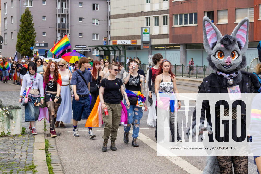 Augsburg, Bavaria, Germany June 13, 2026: Participants carrying rainbow flags and wearing colorful costumes take part in Christopher Street Day (CSD) in Augsburg. The parade through the city center promotes the rights of LGBTQ+ people as well as social diversity and tolerance