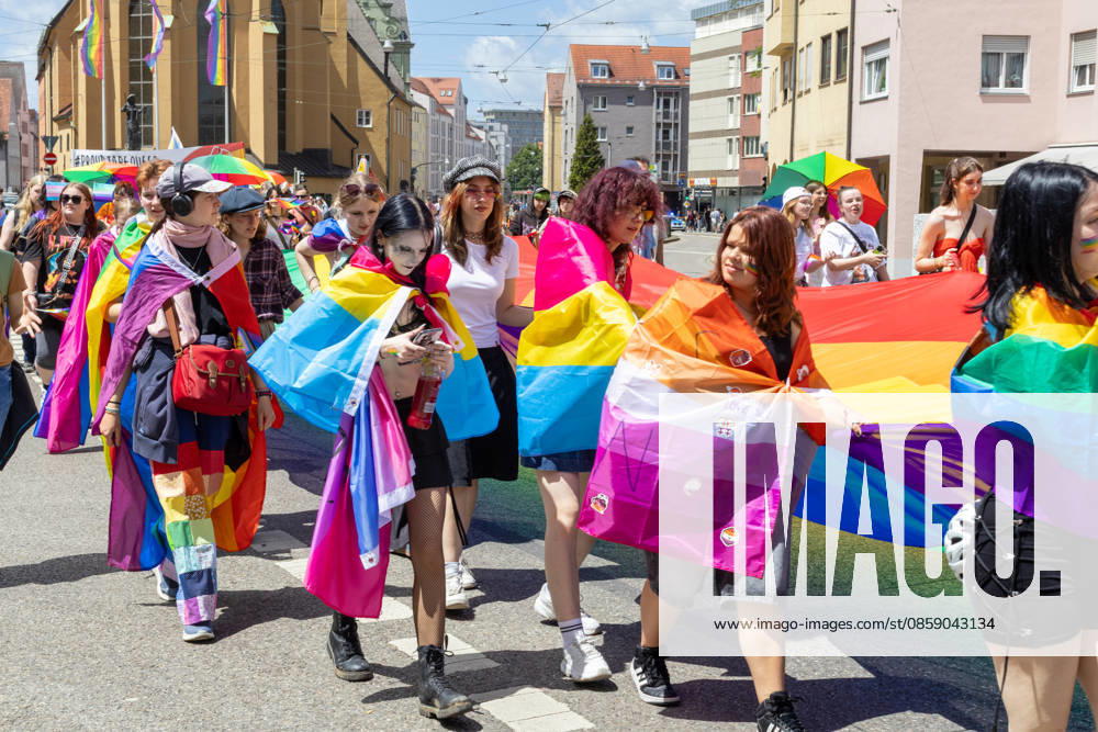Augsburg, Bavaria, Germany June 13, 2026: Participants carrying rainbow flags and wearing colorful costumes take part in Christopher Street Day (CSD) in Augsburg. The parade through the city center promotes the rights of LGBTQ+ people as well as social diversity and tolerance