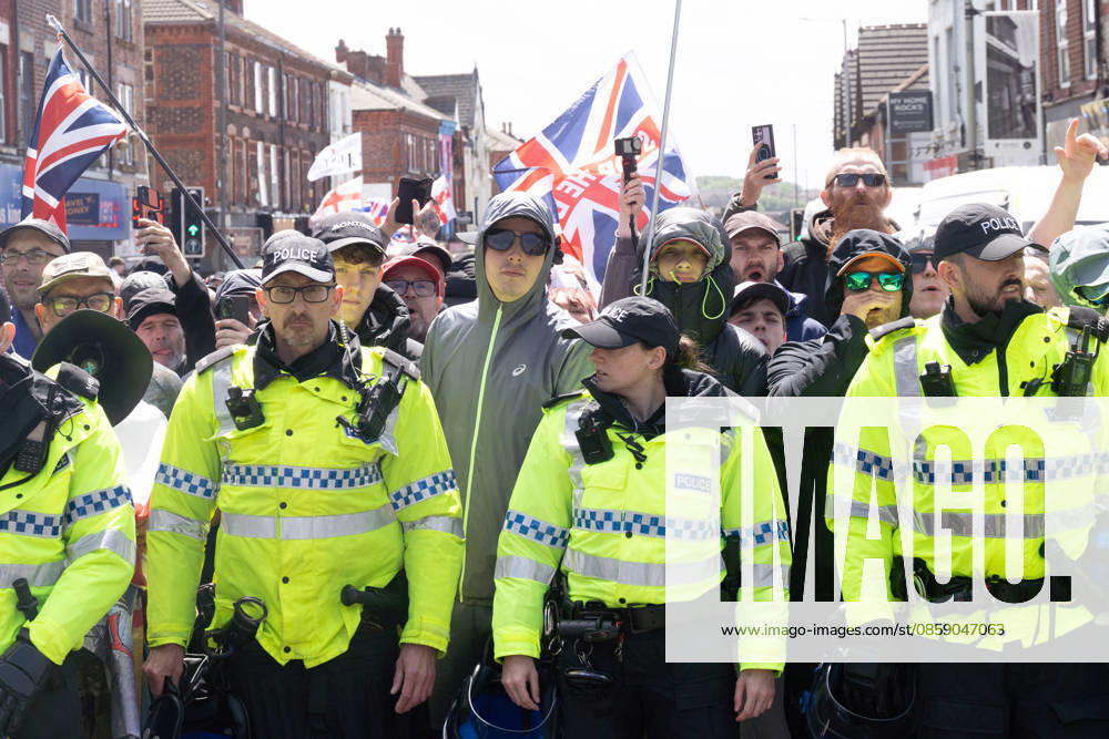 Anti-immigration protest march, Walton, Liverpool, UK, 13 June 2026. A large police presence prevents major disorder at an anti-immigration, pro-deportation protest march in Walton, Liverpool, UK, 13 June 2026., Credit:John Johnson Avalon