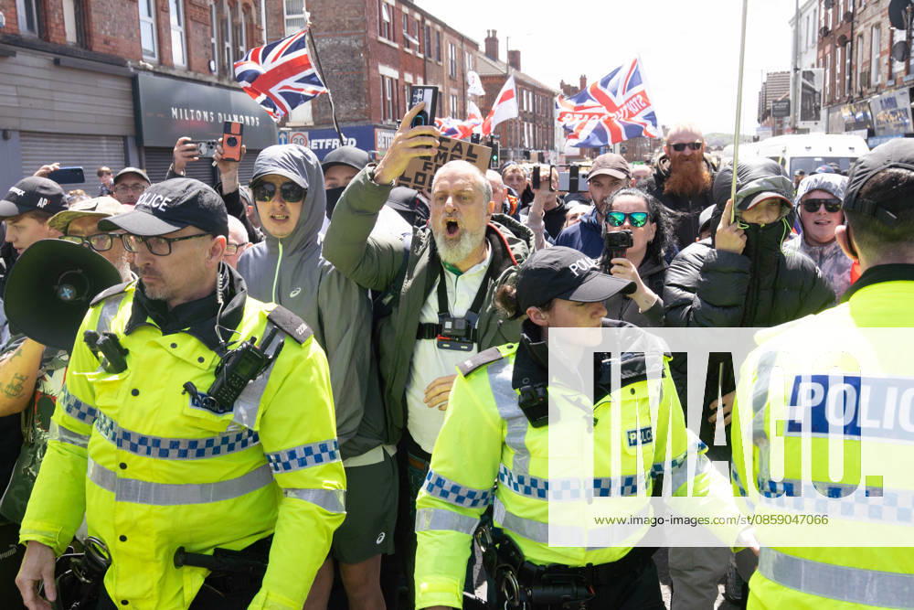 Anti-immigration protest march, Walton, Liverpool, UK, 13 June 2026. A large police presence prevents major disorder at an anti-immigration, pro-deportation protest march in Walton, Liverpool, UK, 13 June 2026., Credit:John Johnson Avalon