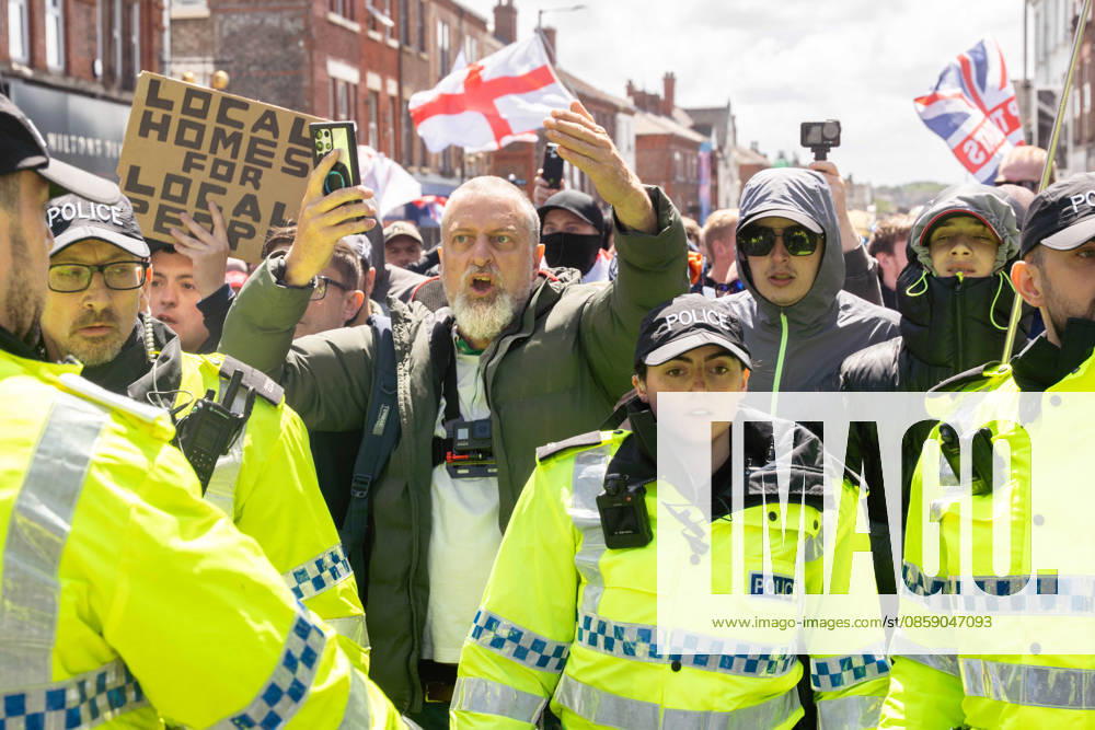 Anti-immigration protest march, Walton, Liverpool, UK, 13 June 2026. A large police presence prevents major disorder at an anti-immigration, pro-deportation protest march in Walton, Liverpool, UK, 13 June 2026., Credit:John Johnson Avalon