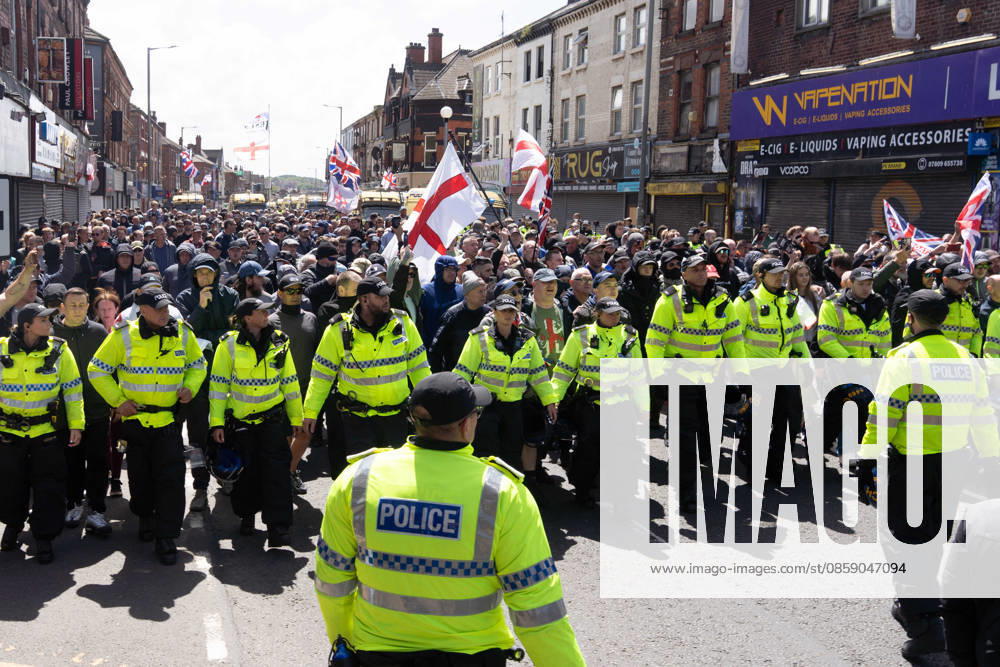 Anti-immigration protest march, Walton, Liverpool, UK, 13 June 2026. A large police presence prevents major disorder at an anti-immigration, pro-deportation protest march in Walton, Liverpool, UK, 13 June 2026., Credit:John Johnson Avalon