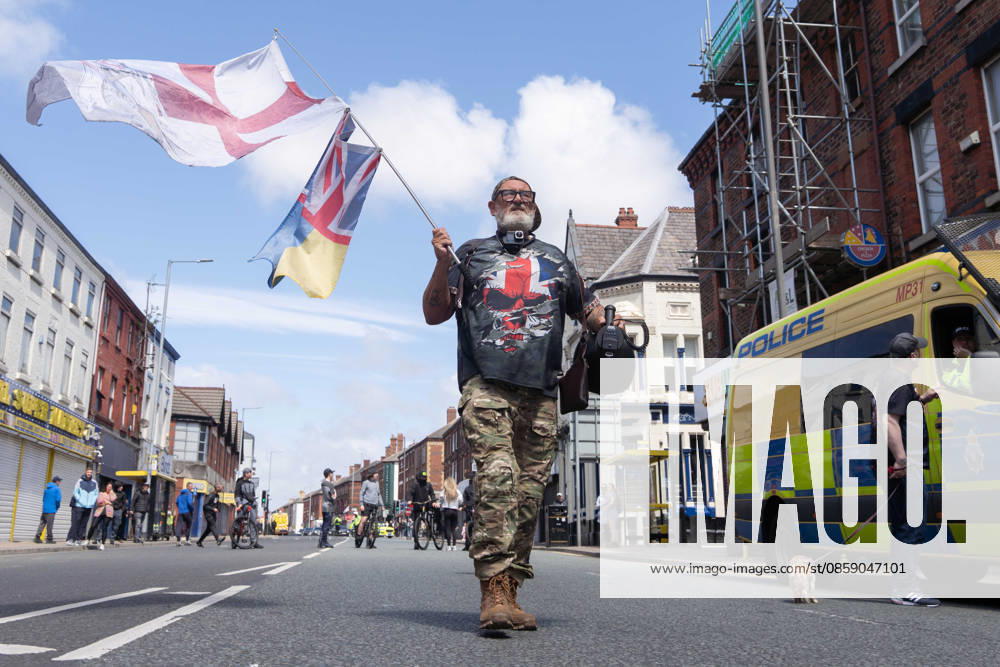 Anti-immigration protest march, Walton, Liverpool, UK, 13 June 2026. A large police presence prevents major disorder at an anti-immigration, pro-deportation protest march in Walton, Liverpool, UK, 13 June 2026., Credit:John Johnson Avalon