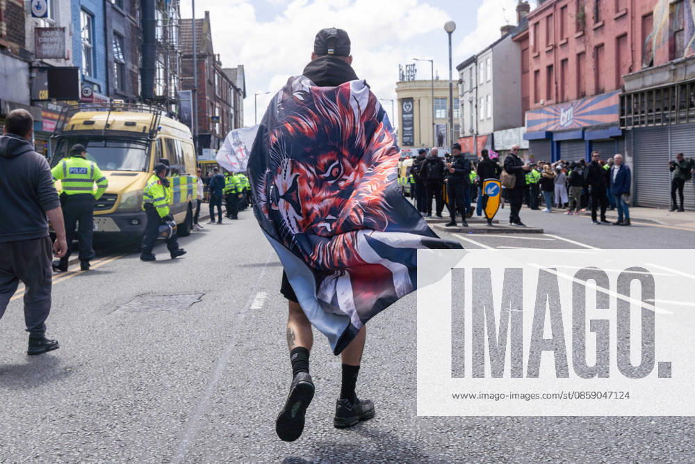 Anti-immigration protest march, Walton, Liverpool, UK, 13 June 2026. A large police presence prevents major disorder at an anti-immigration, pro-deportation protest march in Walton, Liverpool, UK, 13 June 2026., Credit:John Johnson Avalon
