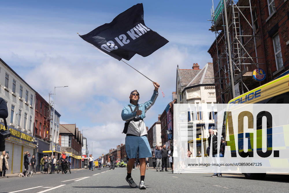 Anti-immigration protest march, Walton, Liverpool, UK, 13 June 2026. A large police presence prevents major disorder at an anti-immigration, pro-deportation protest march in Walton, Liverpool, UK, 13 June 2026., Credit:John Johnson Avalon