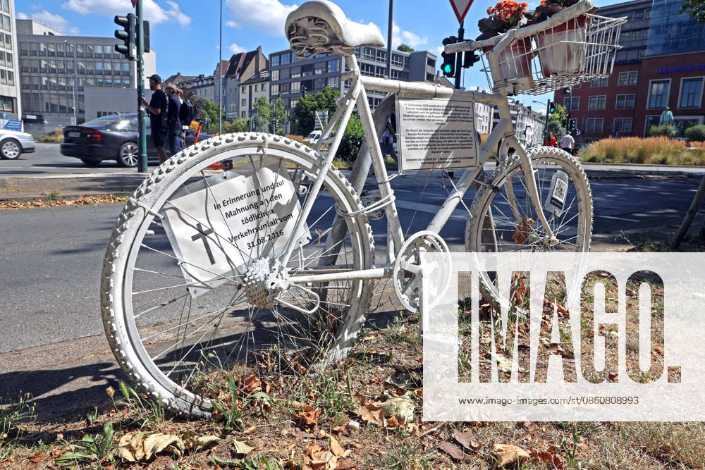Fatal Bicycle Accidents: A so-called white ghost bike stands on the side of a heavily trafficked road—considered an accident black spot—following a fatal accident in Essen, North Rhine-Westphalia, Germany