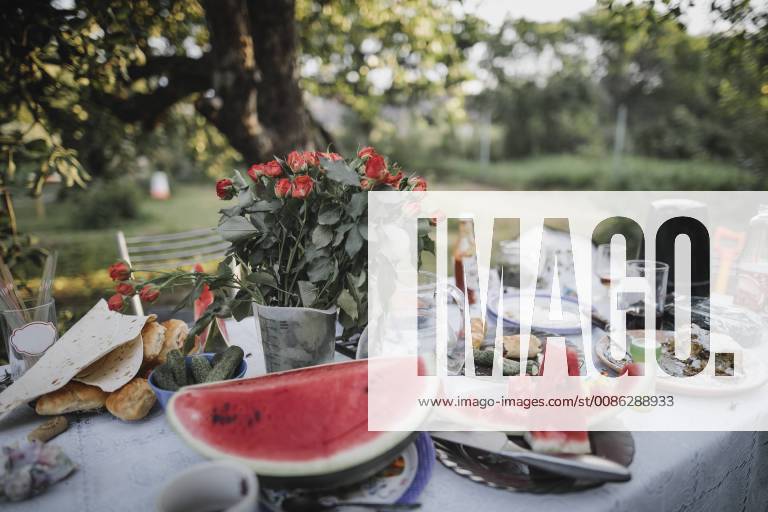 Table with leftovers of garden party property released KMKF00525