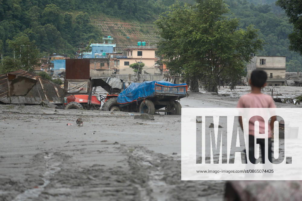Nepal Disaster: The Second Day Of Devastation, Rescue And Recovery People observe the aftermath of flooding in Nuwakot, Nepal, on August 27, 2026, following an outburst of a glacial lake in Tibet. Nuwakot Nepal