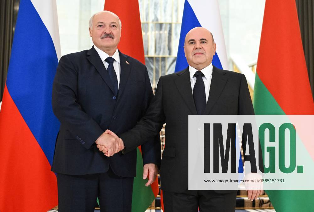 Russia Belarus 9230554 28.08.2026 Russian Prime Minister Mikhail Mishustin and Belarusian President Alexander Lukashenko, left, shake hands as they pose for photos during a meeting, in Moscow, Russia. Alexander Miridonov Sputnik Moscow Russia