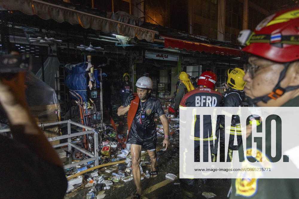 Bangkok Fire Engulfs Klongthom Centre Firefighters and rescue workers move through debris and damaged shopfronts inside the market complex during firefighting operations at Klongthom Centre on Worachak Road in Pom Prap Sattru Phai, Bangkok, Thailand, on August 28, 2026. The fire was reported at 8:42 p.m. at Klongthom Centre on Worachak Road, where flames spread from a ground-floor shop across the ground floor and mezzanine beneath the parking area; parts of the structure subsided, several emergency personnel were injured, and firefighters brought the blaze under control at about 11:15 p.m. Bangkok Bangkok Thailand