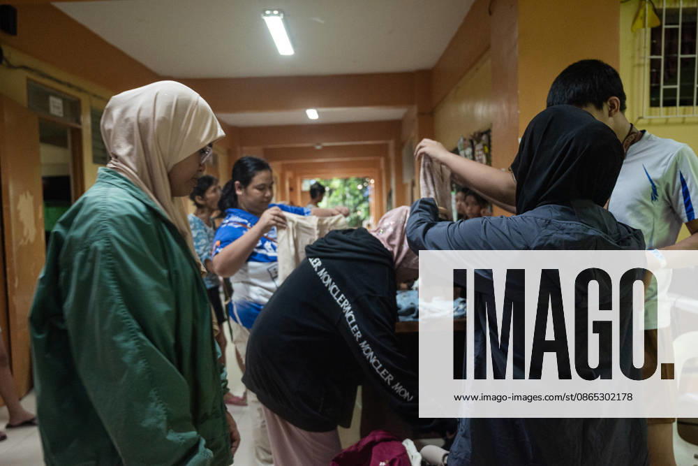 On August 29, 2026, heavy monsoon rains caused the La Mesa Dam and the Tullahan river to overflow, flooding nearby low lying areas with water that reached up to over three-storeys. Local government units and barangay volunteers aided the residents as they evacuated to the North Fairview High School where they are accommodated by volunteers and members of the Sangguniang Kabataan. Quezon City Philippines - ZUMAy102 20260830_zip_y102_018