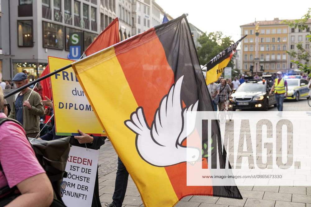 München Munich Germany 2nd September 2026 On the Marienplatz in the centre of the Bavarian city a peace demonstration and march takes place in the early evening. Peace dove and German flag