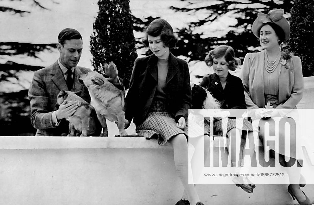 Their Majesties With The Princess -- A Charming picture of their Majesties the King and Queen with the Princess Elizabeth and Margaret and their pet dogs. August 04, 1940. (Photo by London News Agency Ltd.)