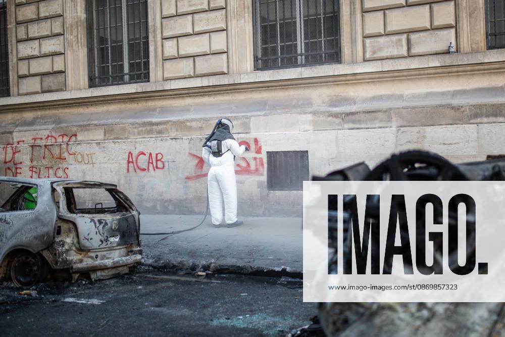 Aftermath of clashes during nationwide protests in Paris PARIS, FRANCE - OCTOBER 18: A worker tries to remove graffiti on a building after a day of violent clashes between police and protesters amid a nationwide mobilisation over rising living costs, fuel prices and education funding in Paris, France, on October 18, 2026. Hesham Elsherif Anadolu Paris France. Editorial use only. Please get in touch for any other usage.