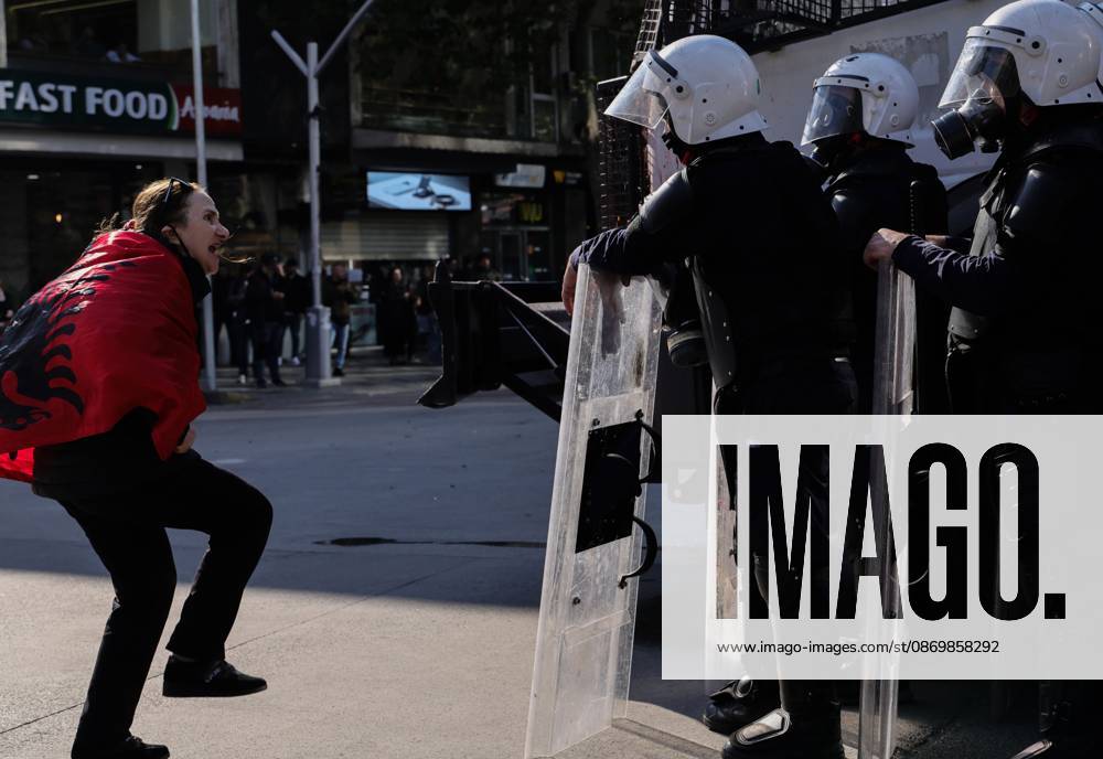 TIRANA, ALBANIA, OCTOBER 18, 2026: Demonstrators clash with riot police outside the Ministry of Education in Tirana as student-led anti-government protests continue for a sixth consecutive day. Protesters throw stones while police respond with tear gas, water cannons and rubber bullets. The demonstrations demand improved university conditions and the resignation of Prime Minister Edi Rama. Tirana Albania - ZUMAq101 20261018_zna_q101_064